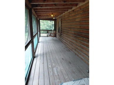 This 2-bedroom, 2-bathroom log cabin offers rustic charm. It is - photo 9