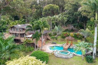Set on 2 acres of lush, tropical grounds, this is a gorgeous - photo 1