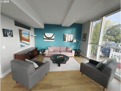 Welcome to 838 SE 38th Ave #307 - a bright and stylish top-floor