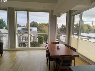 Welcome to 838 SE 38th Ave #307 - a bright and stylish top-floor