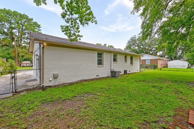Beautifully renovated brick ranch home tucked away in the heart - photo 11