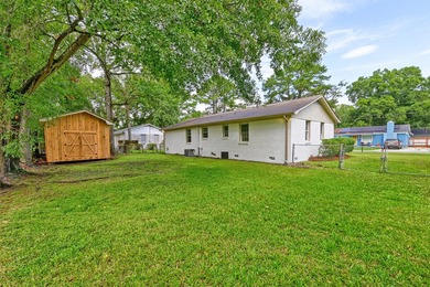 Beautifully renovated brick ranch home tucked away in the heart - photo 12