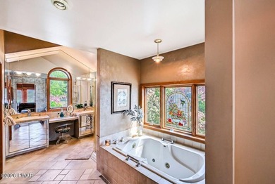 Splendor on the lake! A beautiful manicured, level lot on a - photo 28
