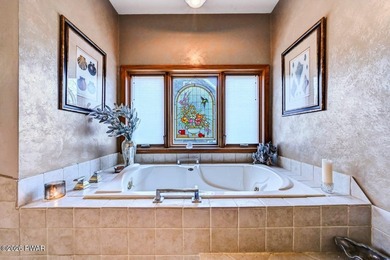 Splendor on the lake! A beautiful manicured, level lot on a - photo 29