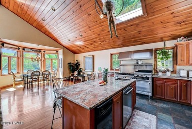 Splendor on the lake! A beautiful manicured, level lot on a - photo 32