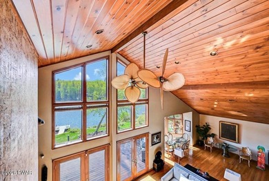 Splendor on the lake! A beautiful manicured, level lot on a - photo 36
