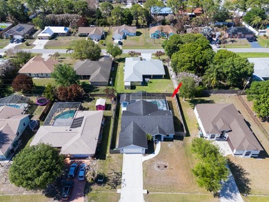 Move-in ready 3/2 pool home with no HOA in Port St. Lucie! This - photo 3