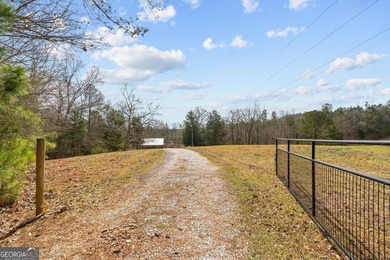 Tucked away on 102 acres of beautiful hardwoods, this property - photo 2
