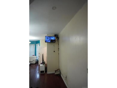 Charming and well-maintained two-family frame house featuring a - photo 3