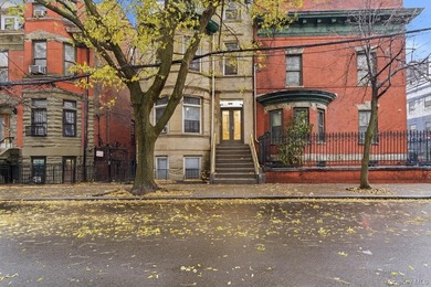 Exceptional brownstone six-unit multi-family building offering a - photo 1
