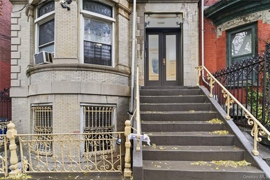 Exceptional brownstone six-unit multi-family building offering a - photo 2