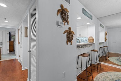 This move-in ready, updated two-bedroom, two-bath condo features