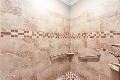 Welcome to this stunning, custom-built 2020 brick home in a