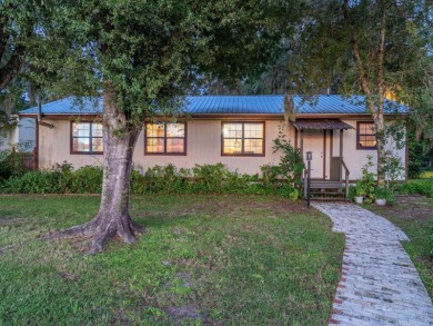 Situated on 2.19 acres with 200 feet of waterfront on Little - photo 3