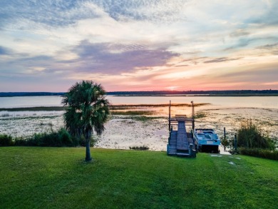 Situated on 2.19 acres with 200 feet of waterfront on Little - photo 5