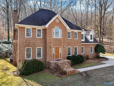 Tucked into the trees on Wyeth Drive in Guntersville, this - photo 2