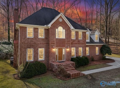 Tucked into the trees on Wyeth Drive in Guntersville, this - photo 3