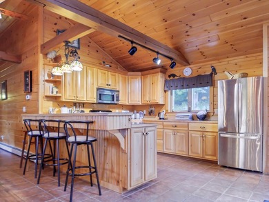 Log home living on Rangeley Lake! This home promises a blend of - photo 11