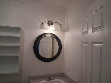 Well-maintained home with gated entry, rock walls, and a paved - photo 22
