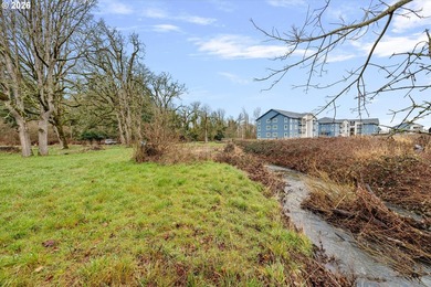 Enjoy 1.15 level acres with a creek running through it, right in - photo 12