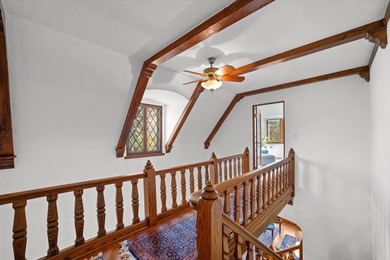 This stately stone Tudor is located east of Lake Drive, just - photo 25