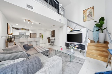 Unique split-level duplex loft in the heart of Brickell. The - photo 1