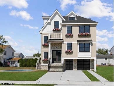 Experience exceptional coastal living in this stunning new - photo 1