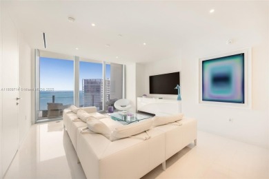 Rising 52 stories above Miami, this move-in ready 1,699 SF
