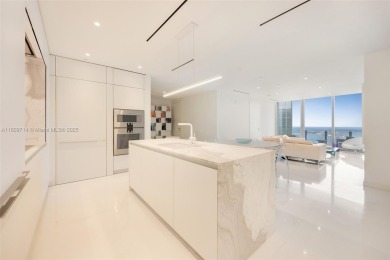 Rising 52 stories above Miami, this move-in ready 1,699 SF