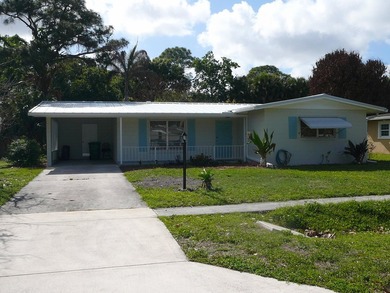 BEAUTIFUL 2/2 WITH CARPORT, CONCRETE BLOCK, NEW METAL ROOF AND - photo 1