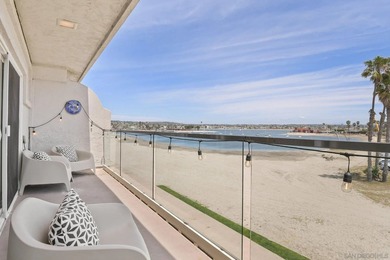 Wake up to sweeping bayfront views in this beautifully updated - photo 1
