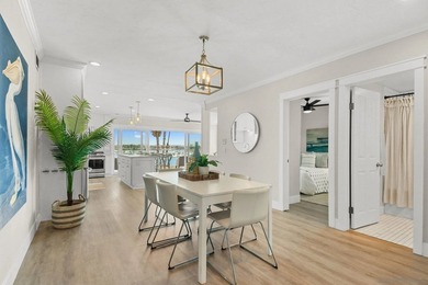 Wake up to sweeping bayfront views in this beautifully updated - photo 8