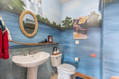 Experience exceptional lakefront living in this custom-built - photo 12