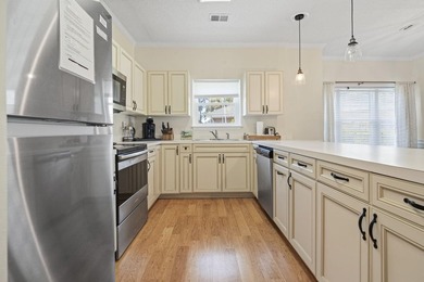 Welcome to this beautiful first-floor end-unit condo in the - photo 5