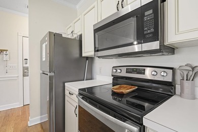 Welcome to this beautiful first-floor end-unit condo in the - photo 8