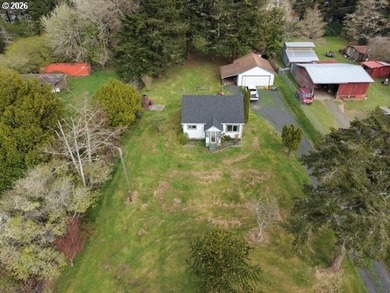 Nearly one-acre level setting with a charming white fence entry - photo 12