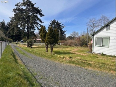 Nearly one-acre level setting with a charming white fence entry - photo 18