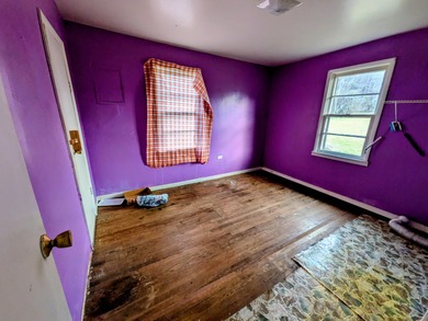 This older farm house sits on 6 beautiful acres of flat open