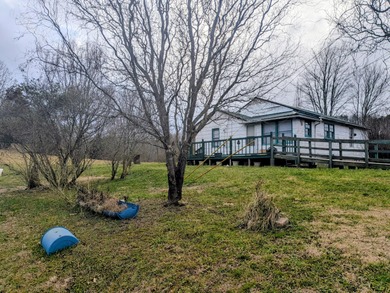 This older farm house sits on 6 beautiful acres of flat open