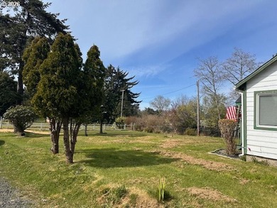 Nearly one-acre level setting with a charming white fence entry - photo 33
