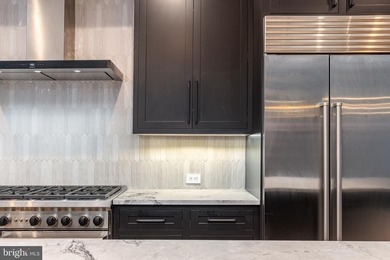 Introducing a rare, newly constructed luxury townhome discreetly