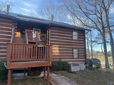 Enjoy lakeside living in this cozy yet upgraded 2nd-story log - photo 3