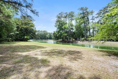 Nestled within the prestigious community of Long Cove Club, this - photo 1