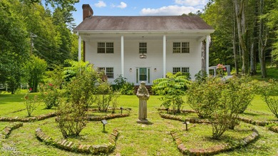 This well-known iconic white farmhouse sits proudly in the heart - photo 3