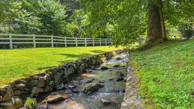 This well-known iconic white farmhouse sits proudly in the heart - photo 6