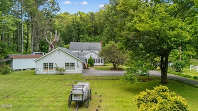 This well-known iconic white farmhouse sits proudly in the heart - photo 8