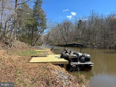Waterfront lot with dock in Blue Ridge Shores: Nestled within - photo 1