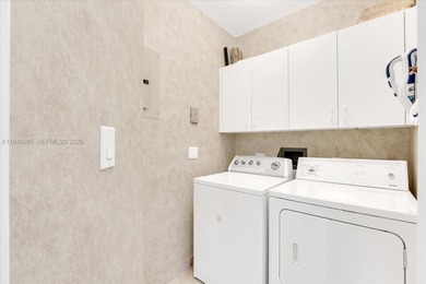 An elegant 3-bedroom residence in the prestigious, gated enclave