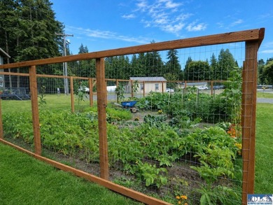 Tucked among mature trees and lovingly maintained, this inviting - photo 12