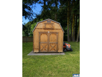 Tucked among mature trees and lovingly maintained, this inviting - photo 15